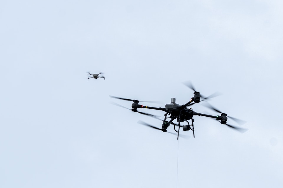 Industrial drones flying autonomously in open sky